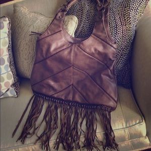 Brown purse with fringe accents